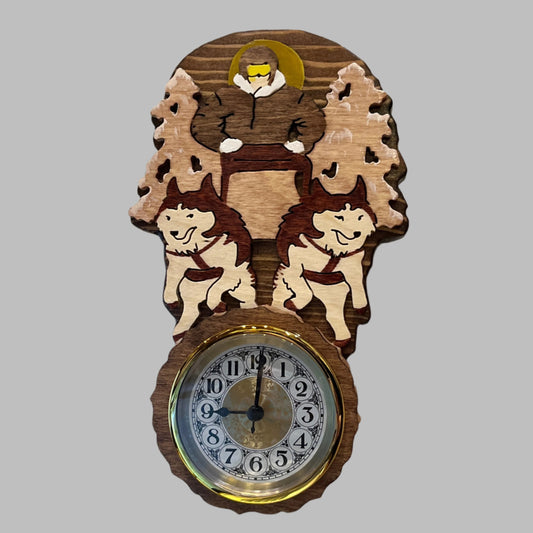 Decorative wall clock with musher and dogs design scroll sawn in wood