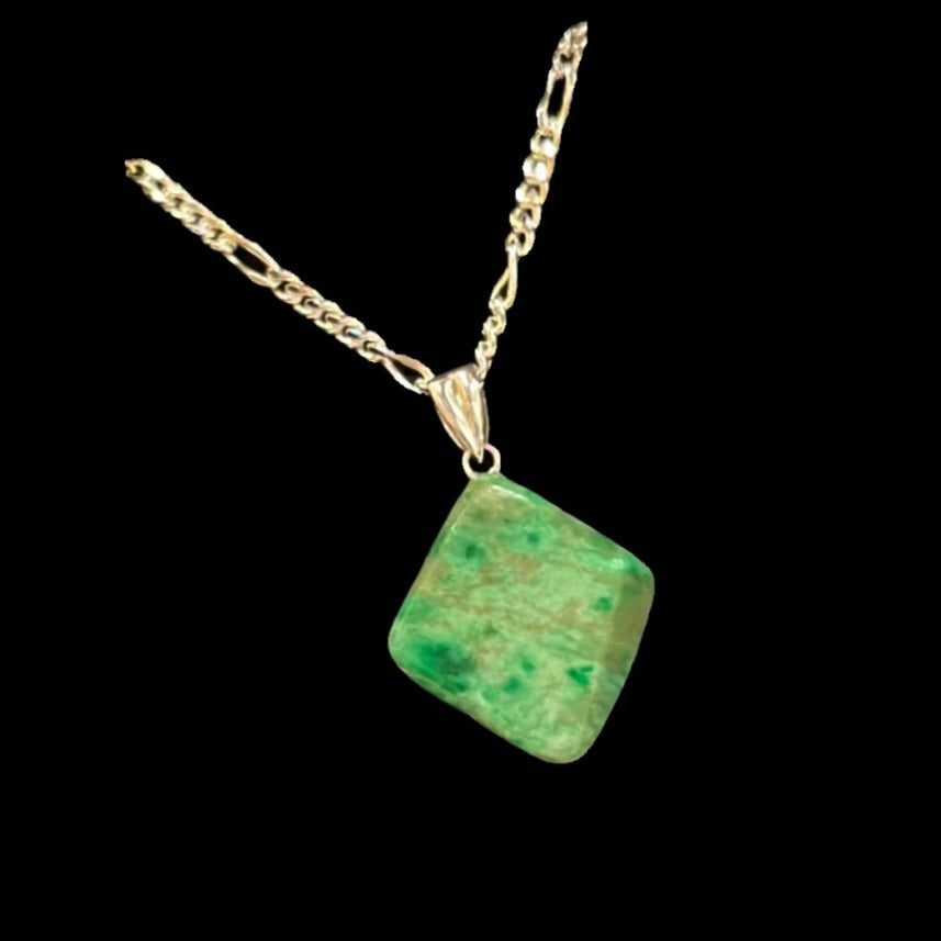 Jade pendant (Diamond shape) on silver chain. This unique piece of jewelry is authentic Alaska Native art created by an enrolled member of an Alaska Native tribe. 
