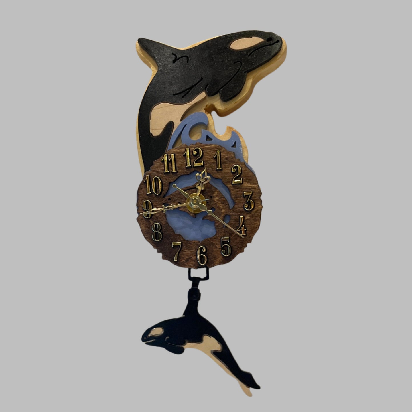 Decorative clock shaped like an orca whale