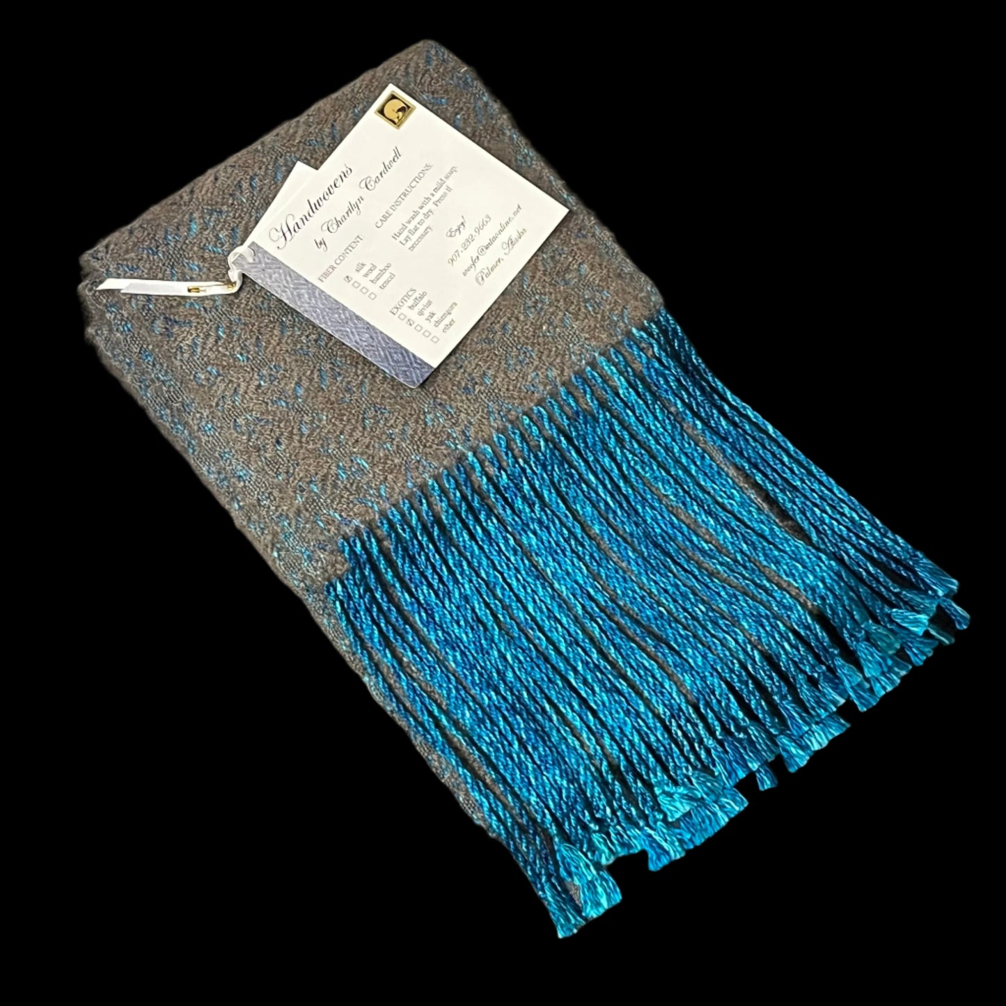 Handmade qiviut (musk ox hair) scarf. The wrap on this scarf is silk, the weft is 100% qiviut. Certified Made in Alaska.