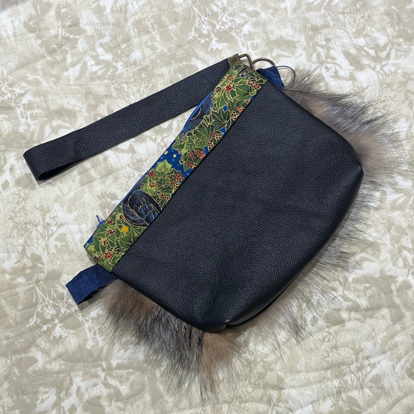 Cross Fox fur clutch purse with strap. Made from leather and silver fox fur with raven and fish trim.