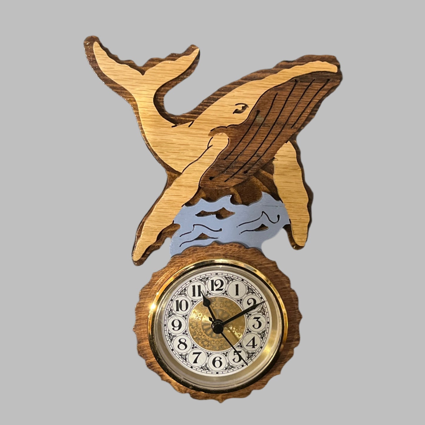 Wooden humpback whale clock, hand scroll sawed, with high quality movements, designed for years of service. One AA battery included.