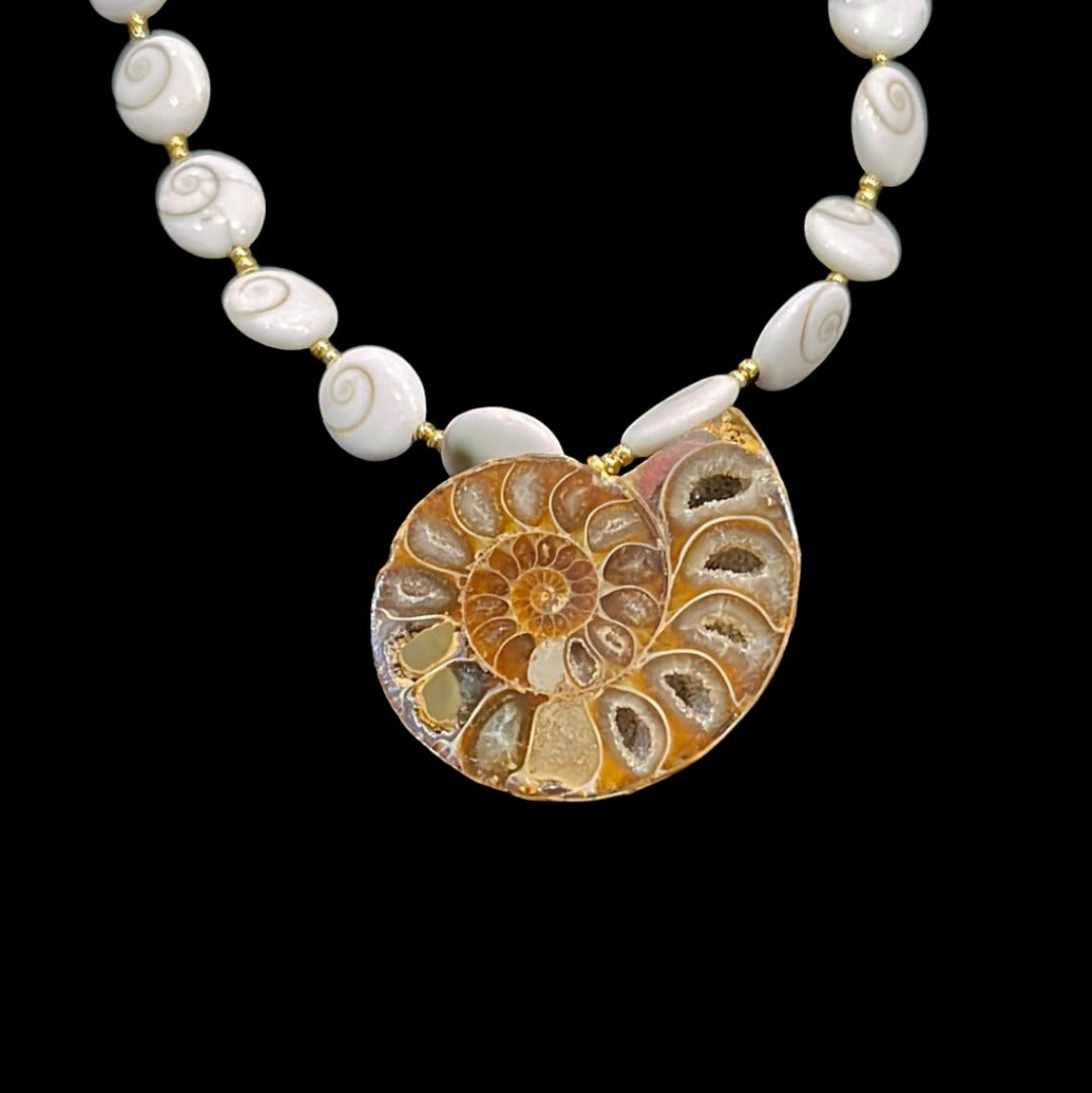 23in Ammonite Pendant Necklace 24kgol/beads spacing polished operculum (snail trap doors) showcasing an opalized Alaskan ammonite. 