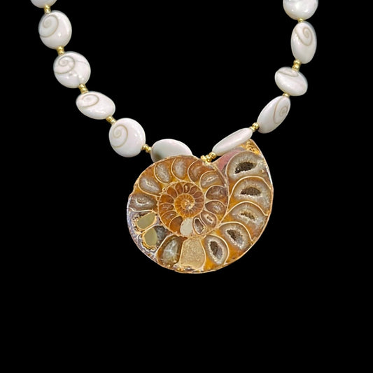 23in Ammonite Pendant Necklace 24kgol/beads spacing polished operculum (snail trap doors) showcasing an opalized Alaskan ammonite. 