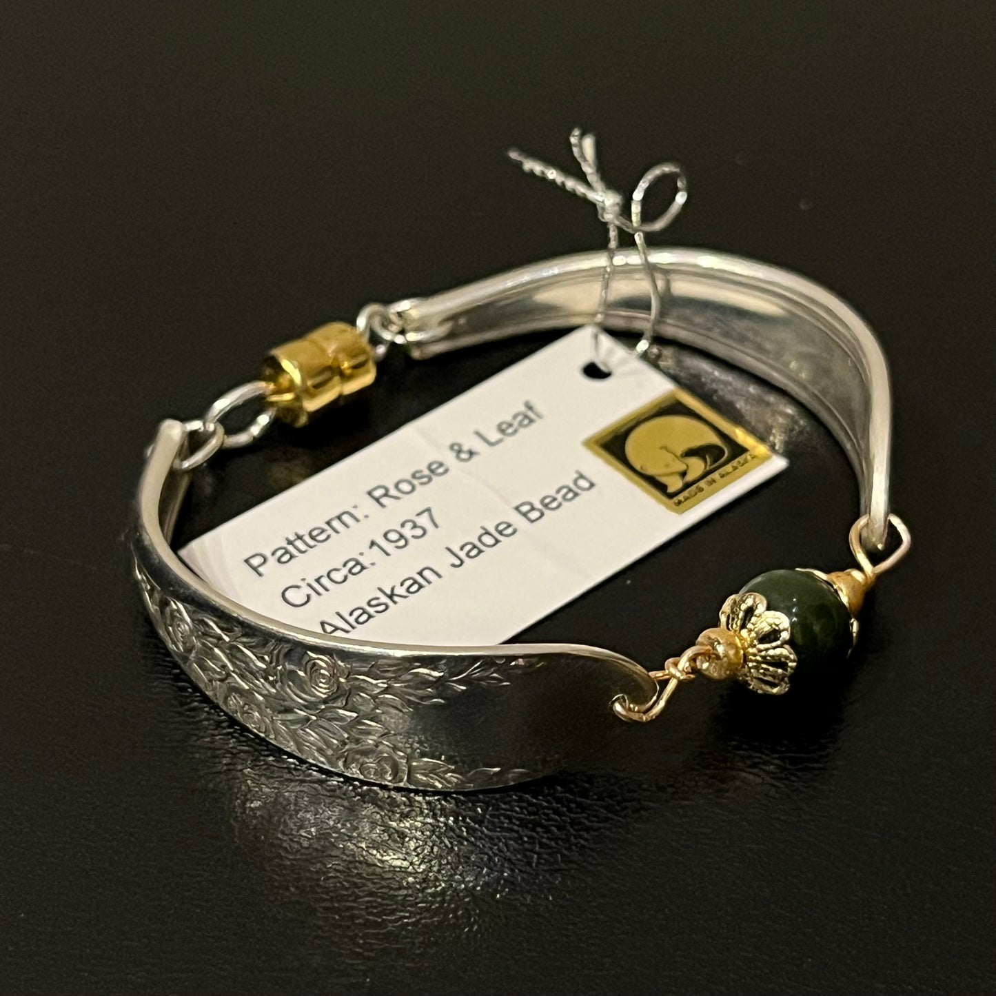 Spoon bracelet with "Rose & Leaf" pattern, circa 1937, jade bead, and magnetic clasp, Certified Made in Alaska jewelry.