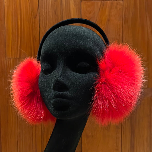 Dyed blue fox earmuffs with black velvet band, one size fits most.