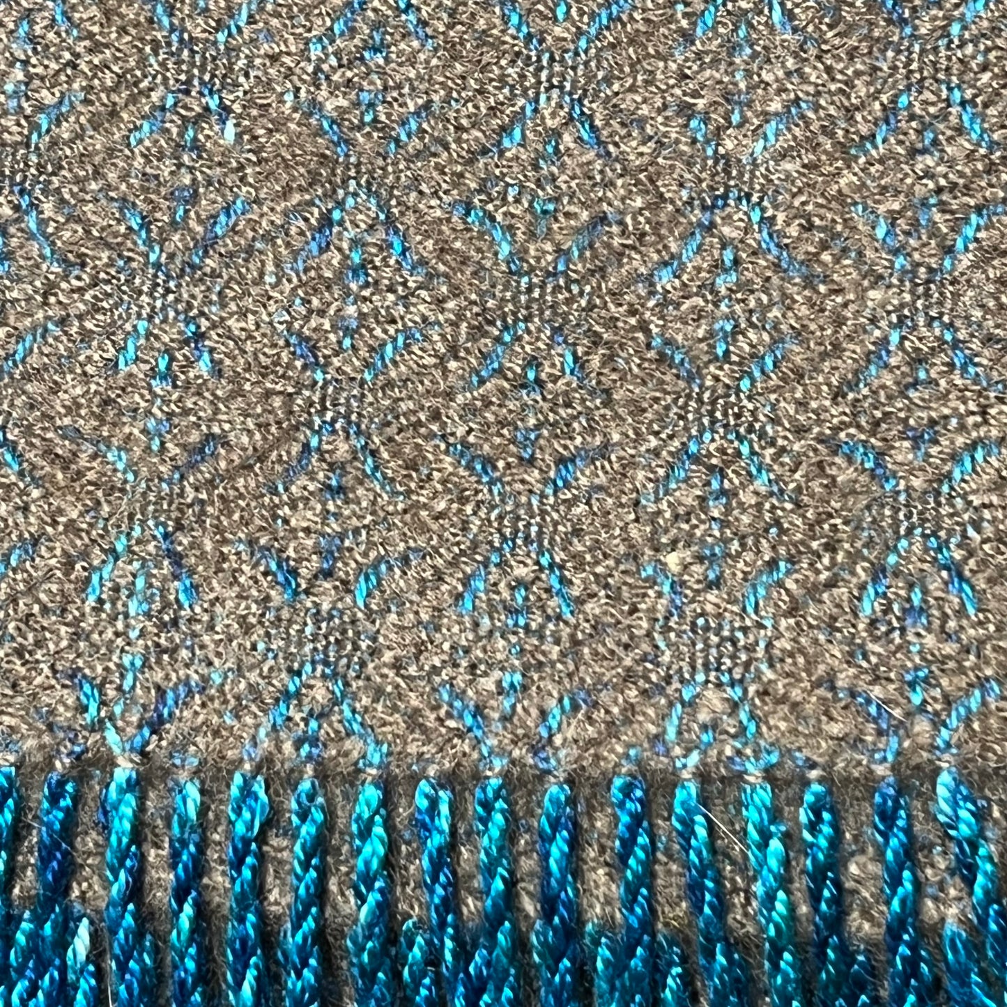 Handmade qiviut (musk ox hair) scarf. The wrap on this scarf is silk, the weft is 100% qiviut. Certified Made in Alaska.