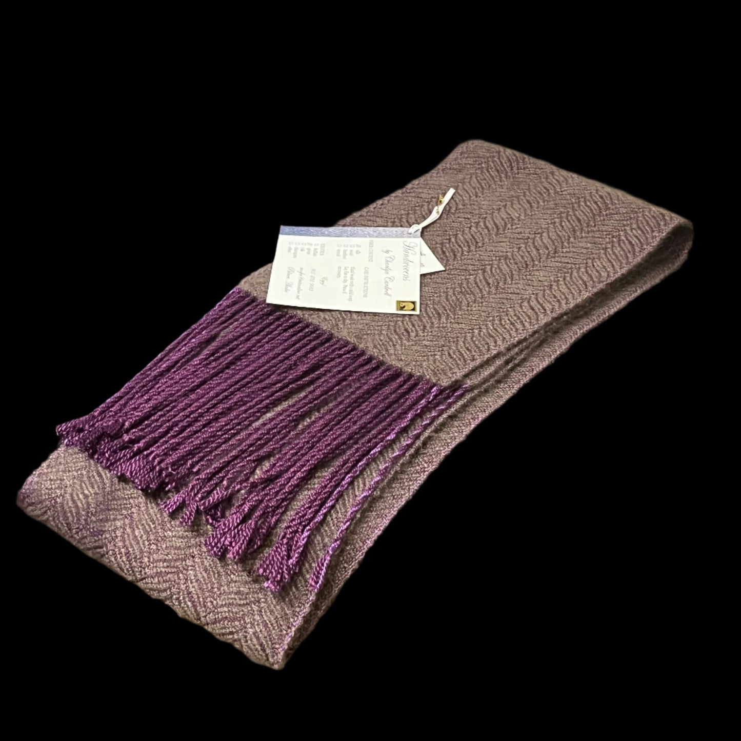 Handmade qiviut (musk ox hair) scarf. The wrap on this scarf is silk, the weft is 100% qiviut. Certified Made in Alaska.