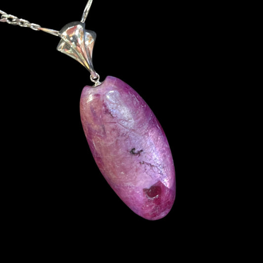 Ruby pendant necklace in sterling silver. Cat's eye finish, made in Alaska.