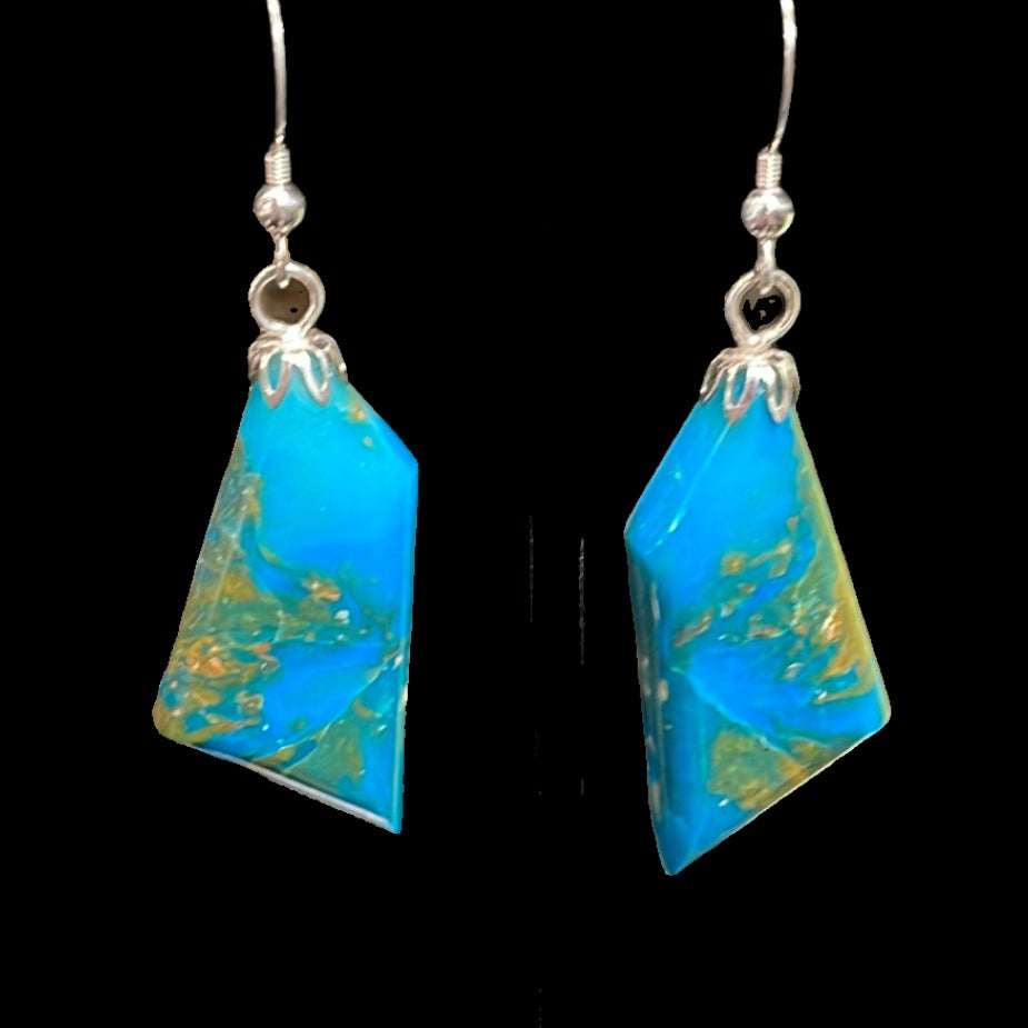 Rectangular turquoise earrings on silver. This unique piece of jewelry is authentic Alaska Native art created by an enrolled member of an Alaska Native tribe.