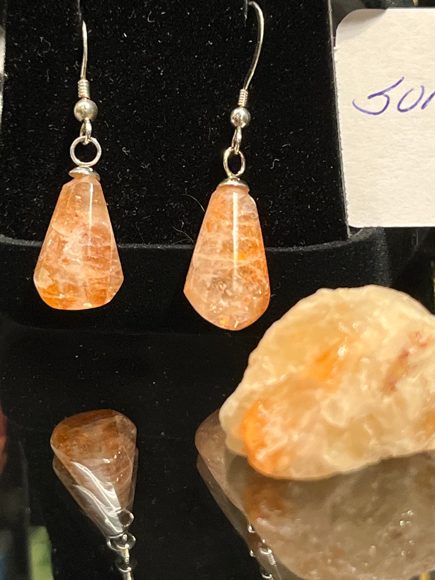 Pear-shaped sunstone earrings on silver. This unique piece of jewelry is authentic Alaska Native art created by an enrolled member of an Alaska Native tribe and is a certified Made in Alaska item.
