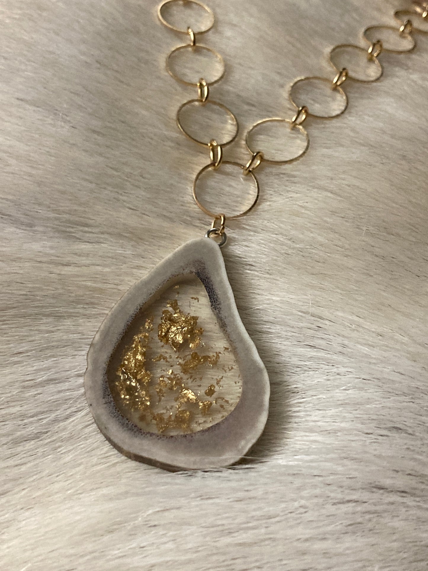 Caribou antler ring pendant necklace with gold flakes