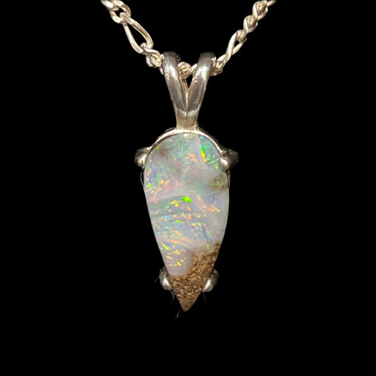 Australian Boulder Opal "Painted Lady" pendant in sterling silver on 20" chain. This is a unique piece of jewelry; you will receive the exact piece shown. Made in Alaska by a registered member of an indigenous tribe.