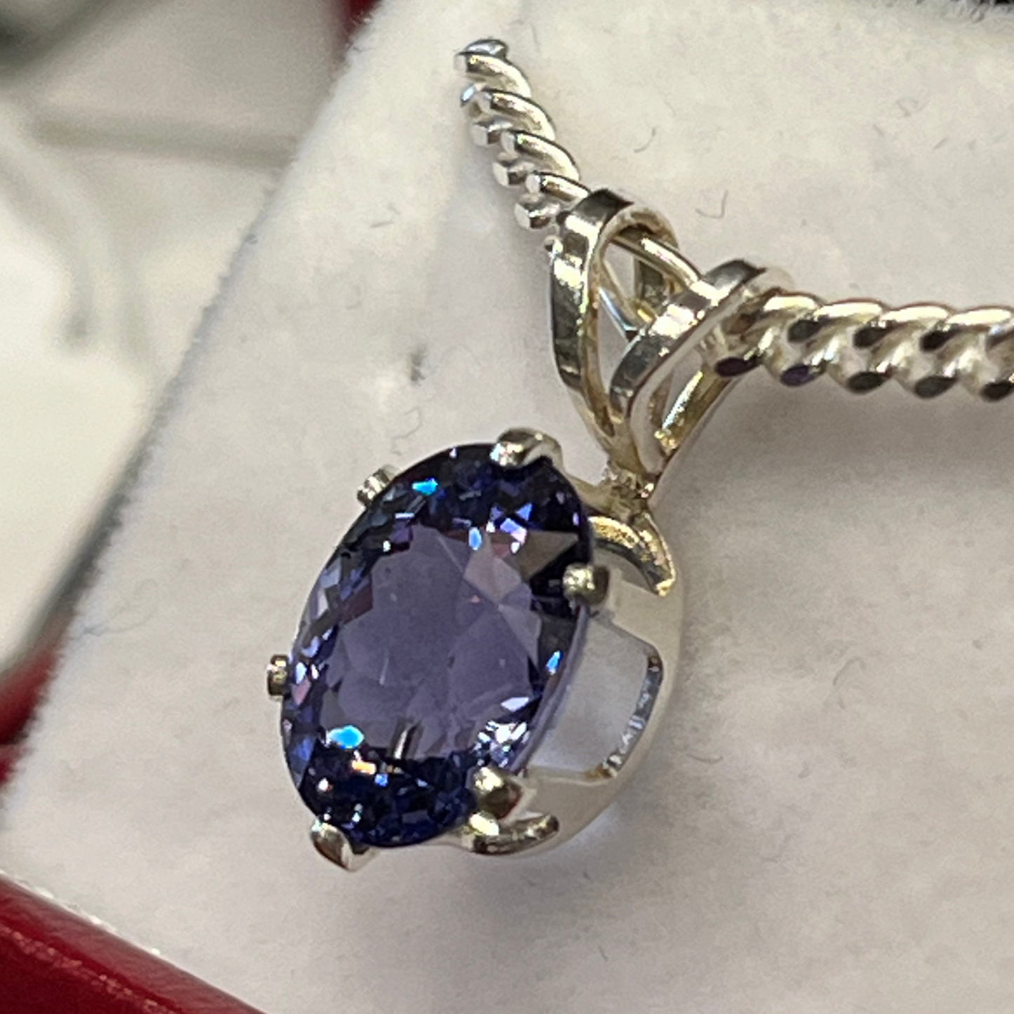 Brilliant 2.29 carat oval Tanzanite pendant in sterling silver on chain. This rare gemstone is a birthstone of December, and is a traditional 24th anniversary gift. This unique piece of jewelry is authentic Alaska Native art created by an enrolled member of an Alaska Native tribe. Certified Silver Hand and Made in Alaska jewelry.