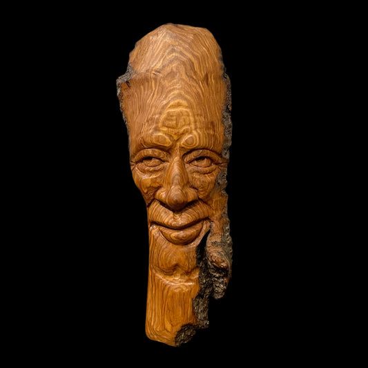 Hand-carved cottonwood bark thinking spirit, measures approx. 10"h x 3.5"w, ready to hang.