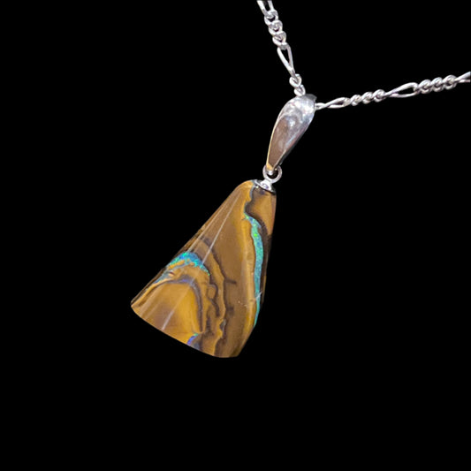Australian Boulder Opal pendant in sterling silver. This is a unique piece of jewelry; you will receive the exact piece shown. Made in Alaska by a registered member of an indigenous tribe.