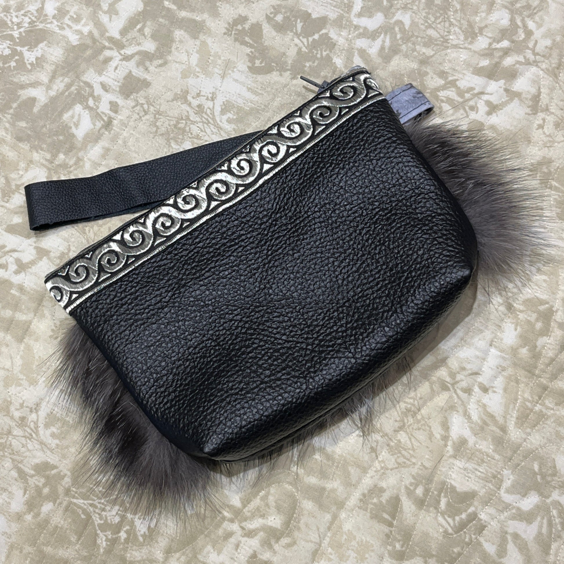 Silver Fox fur clutch purse with strap. Made from leather and silver fox fur with raven and fish trim.